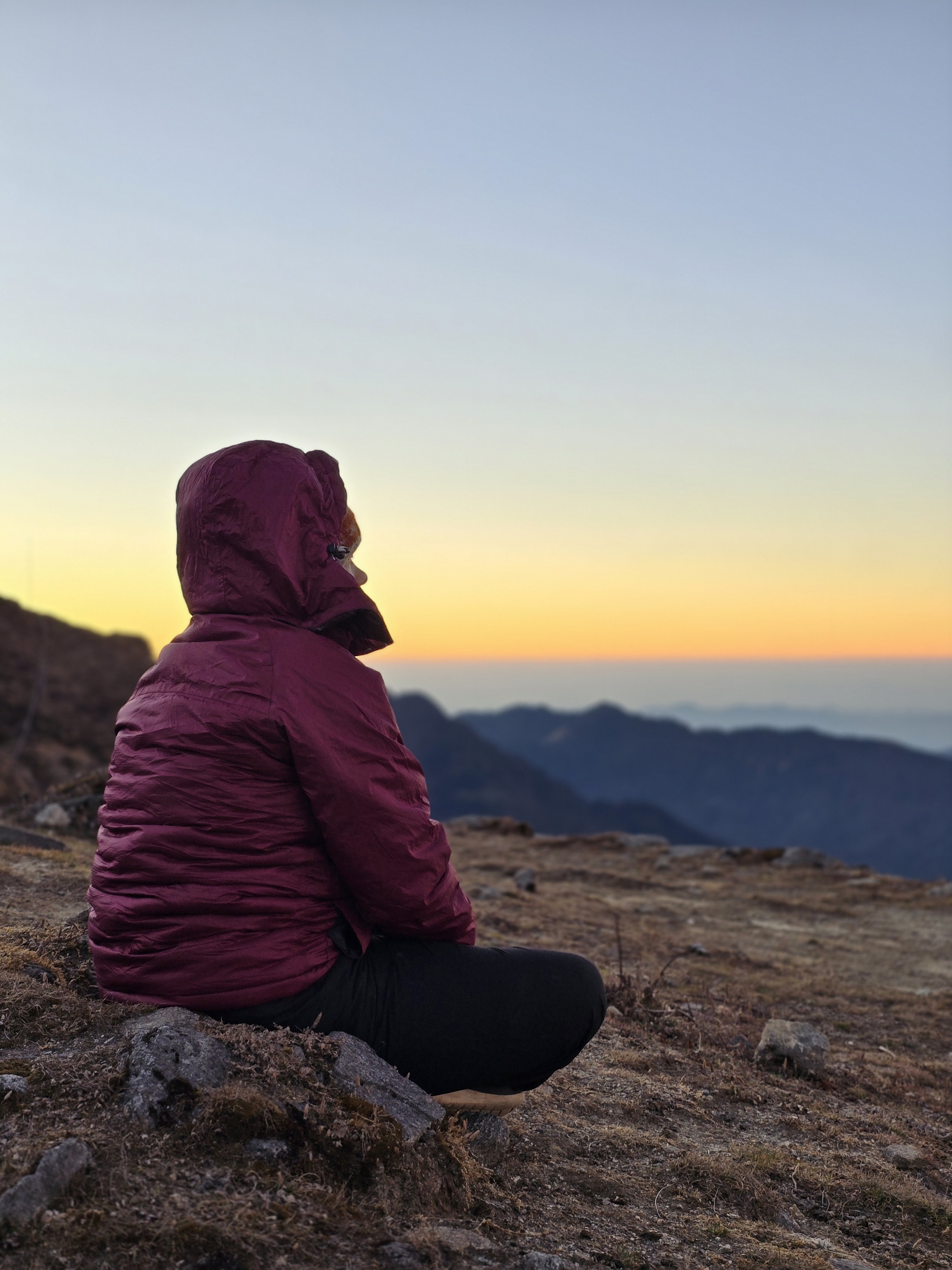 Silhouette at sunset above the cloud line